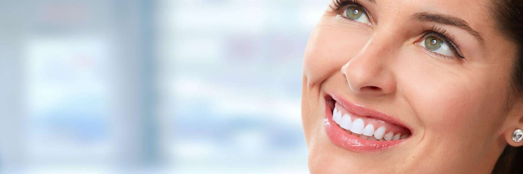 A smiling woman looking up