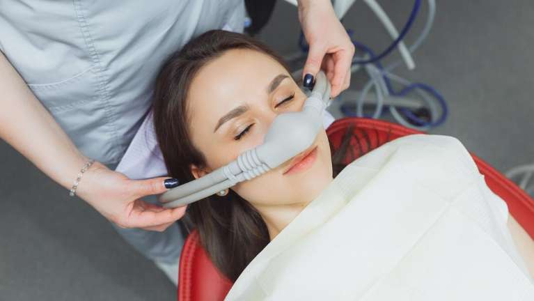 A woman receiving nitrous oxide