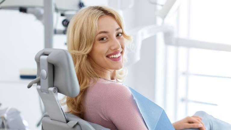 A smiling woman at the dentist