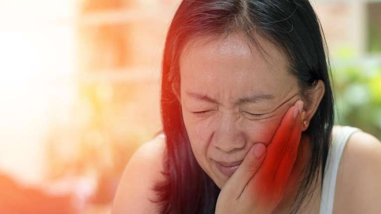 A woman having a dental emergency