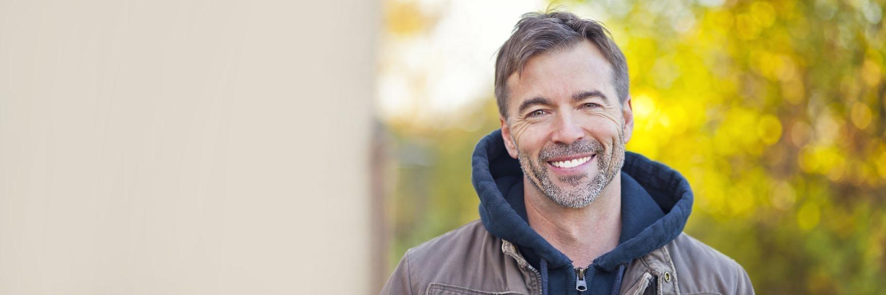 Man smiling with dental implants 