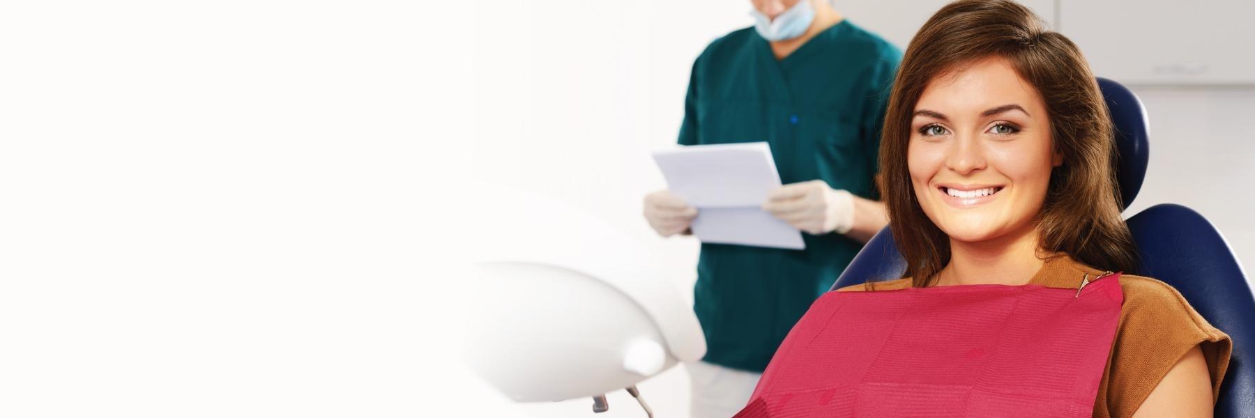 Patient showing off smile after tooth extraction