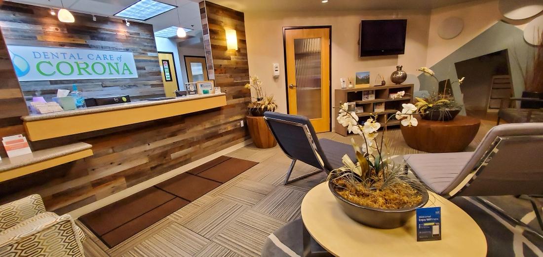 Front desk and waiting room at Dental Care of Corona